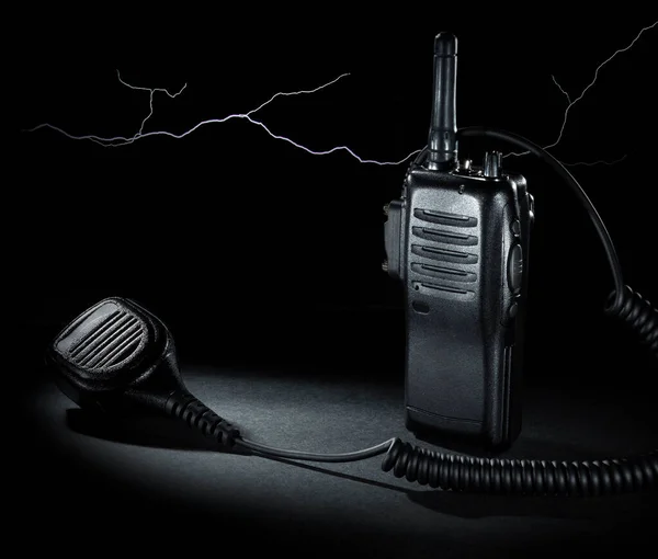 Lightning behind a two way radio and microphone