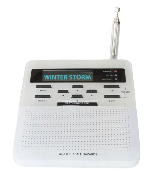 stock image Digital weather and hazards radio that has received a signal and sounded the alarm and displaying the winter storm warning on its screen.