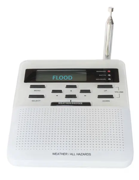 stock image Digital weather radio with a flood warning showing on the screen with the ability to also sound the alarm for other hazards the government issues for the area. 