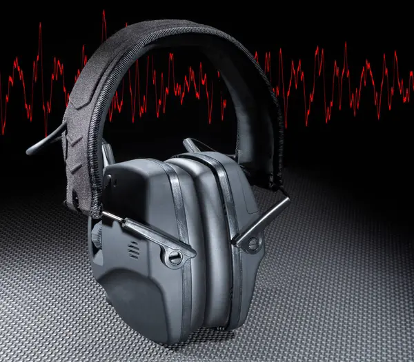Electronic hearing protection headset with a red sine wave in the background
