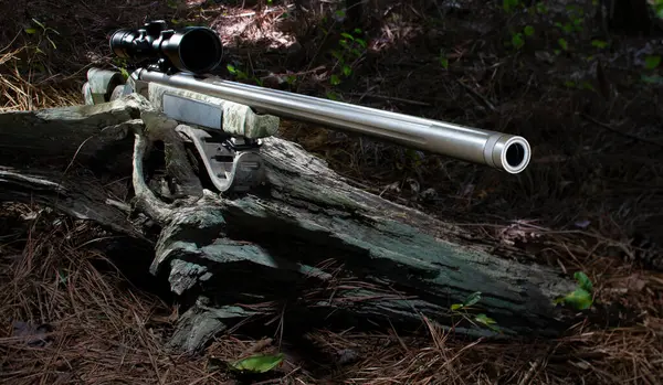 Rifle that uses blackpowder for hunting with a scope mounted