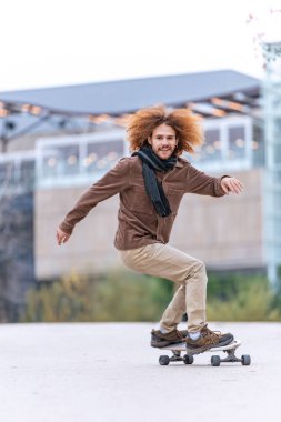 Skateboarder in action, balancing on a board with a focused gaze, urban buildings in the distance enhancing the modern vibe