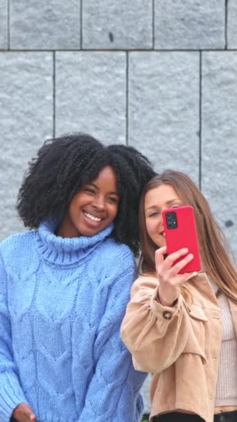 Two Happy Women Taking Selfie Together Joyful Expressions Gray Wall — Stock Video