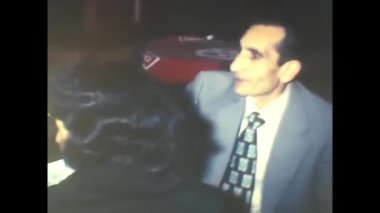 palermo, italy december 1970: bride and groom give favors as a souvenir of the wedding anniversary in the 70s