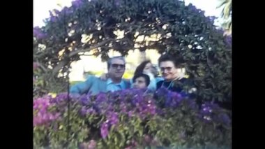 palermo, italy may 1980: people behind a planter in the 80s