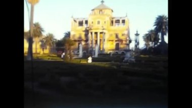 palermo, italy may 1980: people in a villa in a park in the 80s