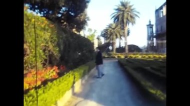 palermo, italy may 1980: dad with happy little girl at the park in the 80s