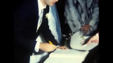 palermo,italy december 1980: bride and groom during the signing in the church in the 80s