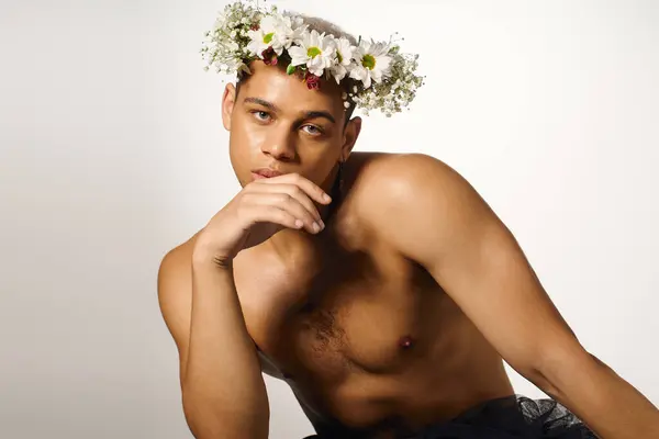 Young African American man showcases style and confidence in a creative studio pose. — Stock Photo