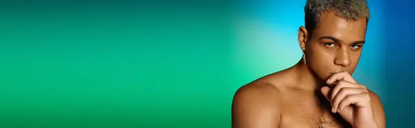 A muscular young african american man with dyed hair poses confidently in a studio, exuding style, banner — Stock Photo