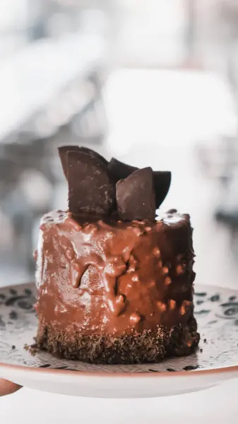 stock image Board with delicious cake on table