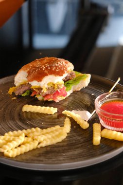 Homemade hamburger with fresh vegetables clipart