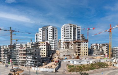 Modiin, Israel, January 12, 2023. Construction of infrastructure and a new residential area. Operation of tower cranes and construction equipment.