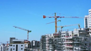 Modiin, Israel, January 12, 2023.Timelapse construction of infrastructure and a new residential area. Operation of tower cranes and construction equipment. High-quality FullHD footage