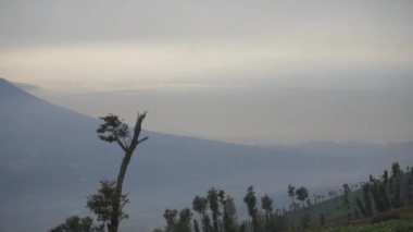 very beautiful natural views with clear skies in the morning with views of Mount Cikuray