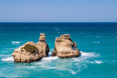 Cliffs and outcrops at Torre dell'Orso beach, Lecce, Italy. Outcrop of Le Due Sorelle in Italian which means the two sisters.
