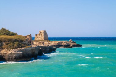 The ruins of the 16th century tower of Roca Vecchia in Lecce, Italy. Rocha Vecchia is an archaeological site located on the Adriatic coast of Apulia in southern Italy.