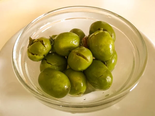 Andalusian style pickled olives in Loja, Granada, Spain. Bowl of olives served as tapas in a Spanish restaurant.