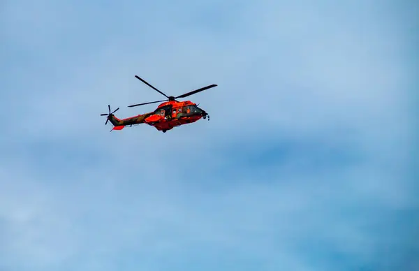 Stock image Madrid, Spain.10 12 2019. AS532 Cougar helicopter of the UME, Military Emergency Unit. Military and emergency services helicopters flying at the Columbus Day military parade in Madrid, Spain.