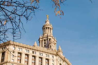 Facade of the David N. Dinkins Municipal Building in Manhattan, New York, USA. Neoclassical style building with Roman details such as the golden statue on the dome called Civic Fame. clipart