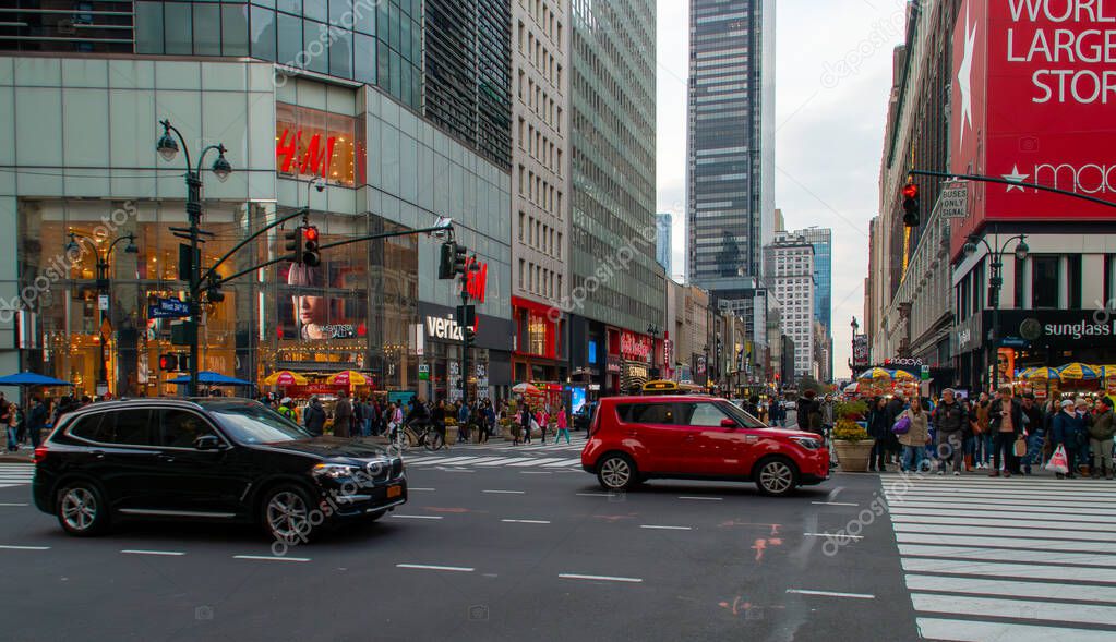 New York, USA. 11 10 2019. Cityscape of the streets of downtown Manhattan. People and cars at the intersection of 6th Ave and W 34th St.