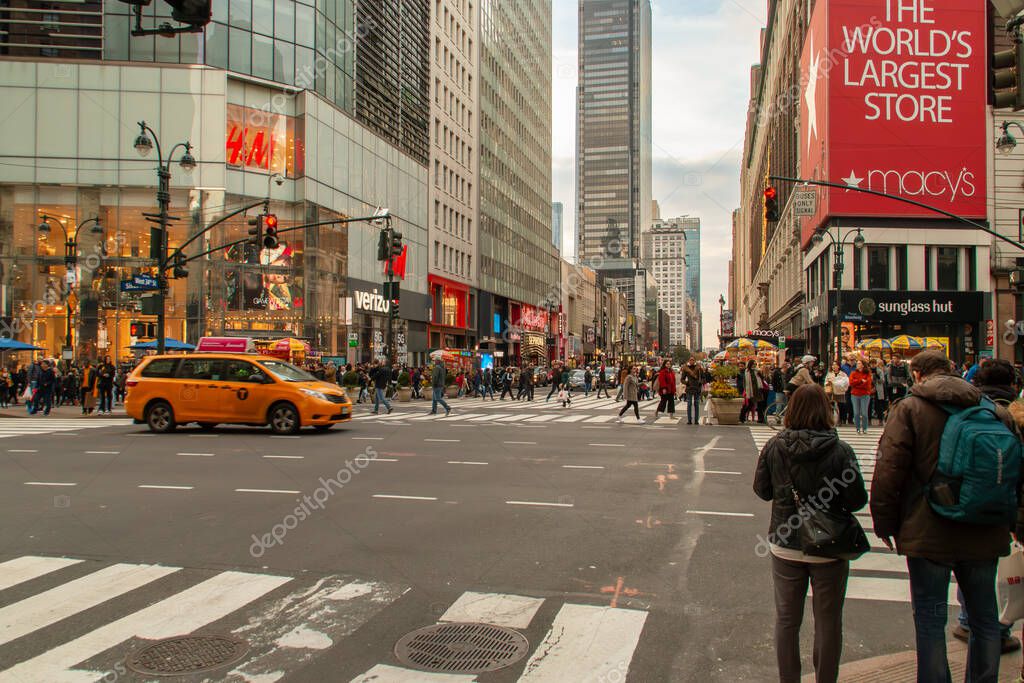 New York, USA. 11 10 2019. Cityscape of the streets of downtown Manhattan. People and cars at the intersection of 6th Ave and W 34th St.