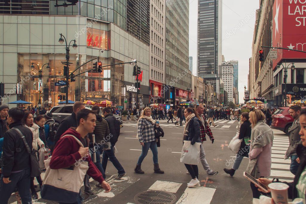New York, USA. 11 10 2019. Cityscape of the streets of downtown Manhattan. People and cars at the intersection of 6th Ave and W 34th St.