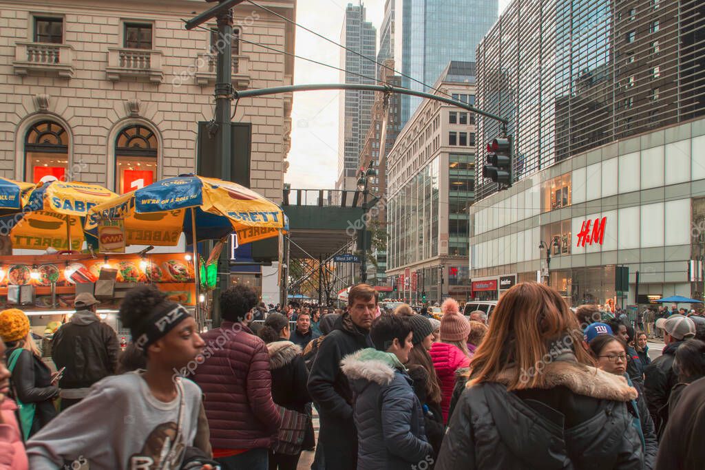 New York, USA. 11 10 2019. Cityscape of the streets of downtown Manhattan. People and cars at the intersection of 6th Ave and W 34th St.