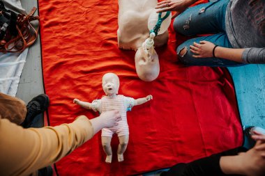 close up: ife size training dummy model, doll face, detail, mannequin mouth wide open, medical equipment. Paramedic class training simple props abstract concept