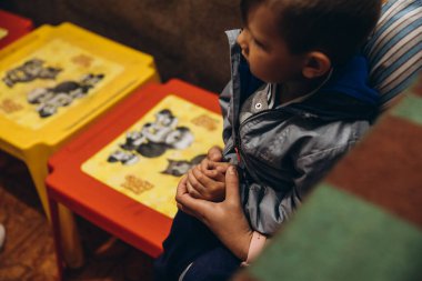 07.07.22 Irpin, Ukraine: small children and their caregivers are evacuated to an underground cellar used as a shelter during an air raid