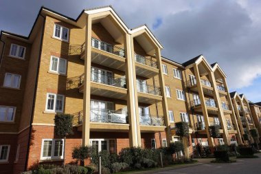 Modern three storey apartment building with balconies