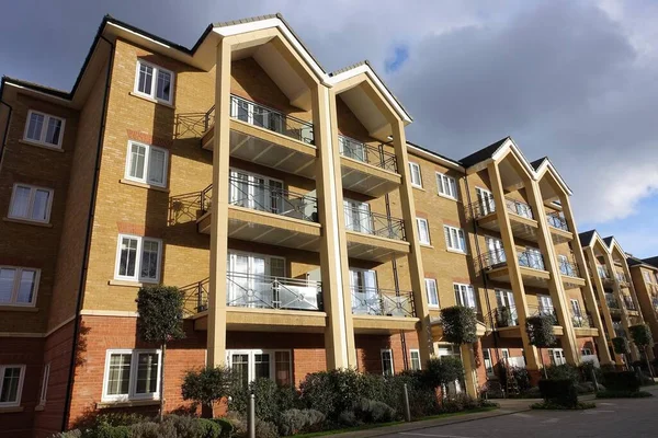 Modern three storey apartment building with balconies