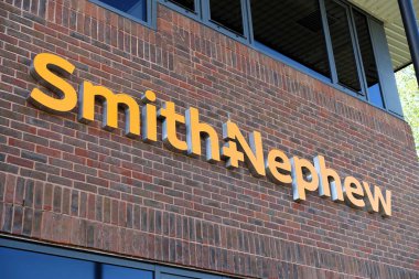 Smith and Nephew company logo sign at headquarters in Croxley Park, Hatters Lane, Watford clipart