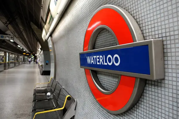 stock image Waterloo Station, London Underground roundel sign on the platform