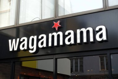 Wagamama, a British restaurant chain, specializes in Asian cuisine inspired by Japanese culinary traditions. clipart