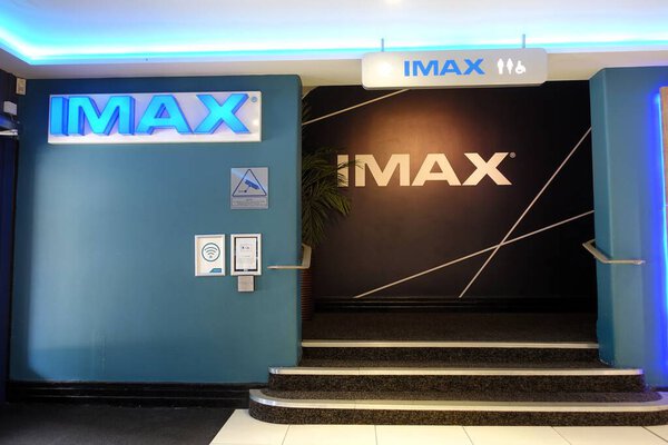 The cinema's entrance is marked by interior steps that lead to an enormous IMAX screen.