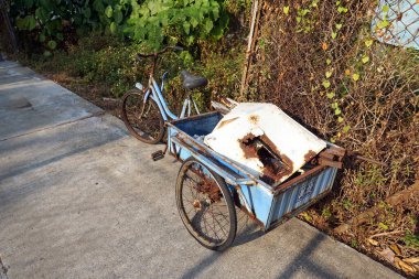 old rusty bicycle on the street