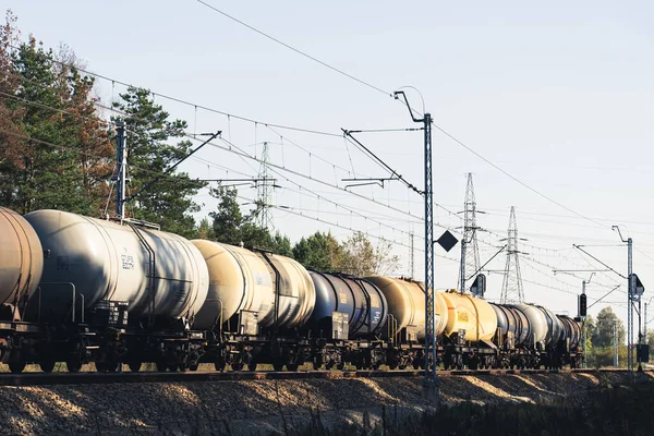 Freight train with oil tanks moving on the railroad. High quality photo