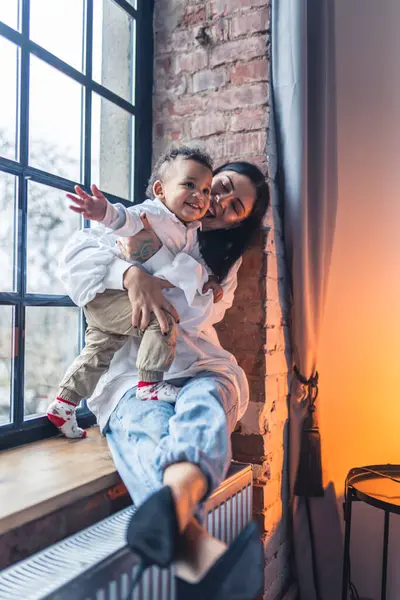 Vertical Shot Happy Woman Her Toddler Son Window Sill High — Stockfoto