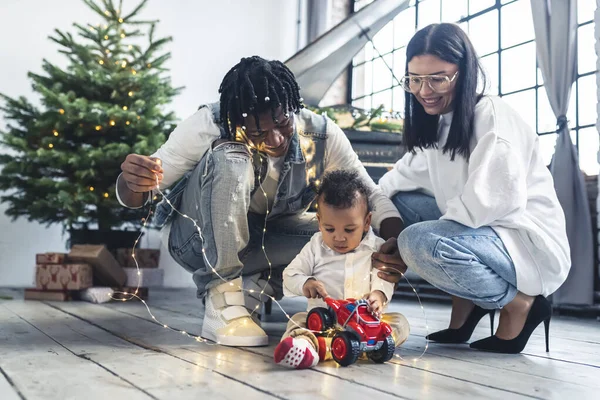 Multiracial Parents Son Playing Christmas Tree High Quality Photo — Φωτογραφία Αρχείου