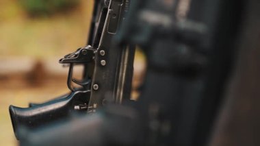 Closeup of a trigger of a gun. High quality 4k footage