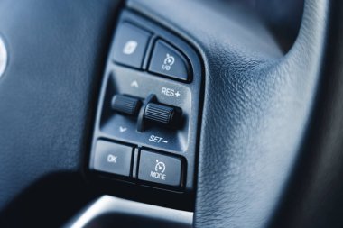 Buttons for a better and more comfortable ride. Benefits and more options of new vehicles. High quality photo