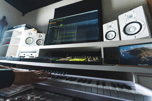 Music production desk with audio equipment and tools for home studio producers . High quality photo