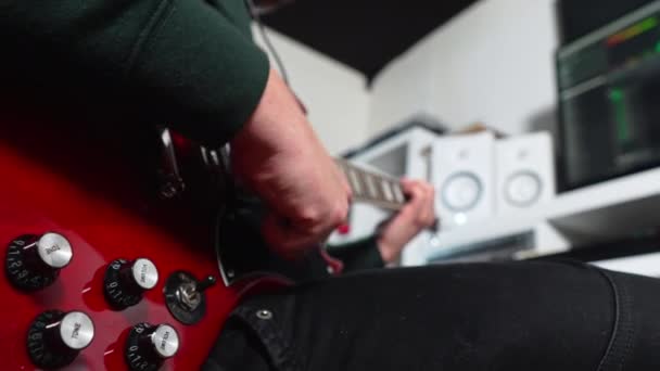 Man Playing Red Electric Guitar Music Recording Home Studio High — стоковое видео