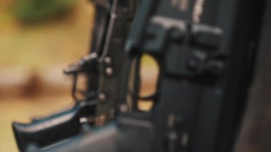 Military rifles . Slow motion video of two rifles. The only way to use trigger on a rifle. High quality 4k footage