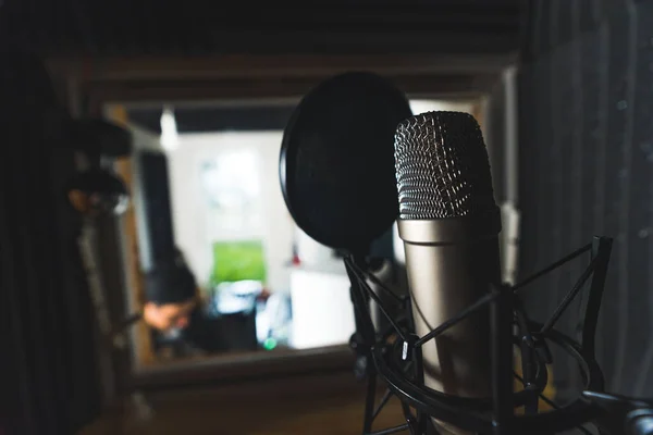 Microphone with a pop filter at home music recording studio. High quality photo
