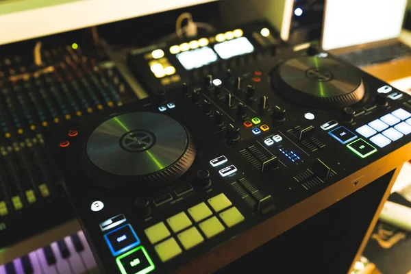 DJ professional music console home studio setup. High quality photo