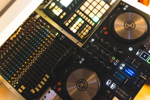 DJ professional music console home studio setup. High quality photo