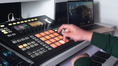 Man DJ creating music on a toolbox for beat making . High quality 4k footage