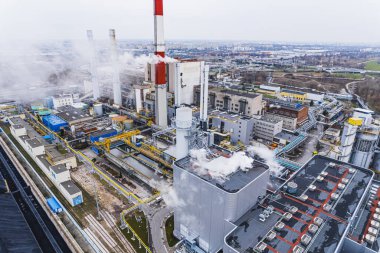 Aerial view of Zeran heat power station with smoke emissions from the chimney in Warsaw, Poland. High quality photo